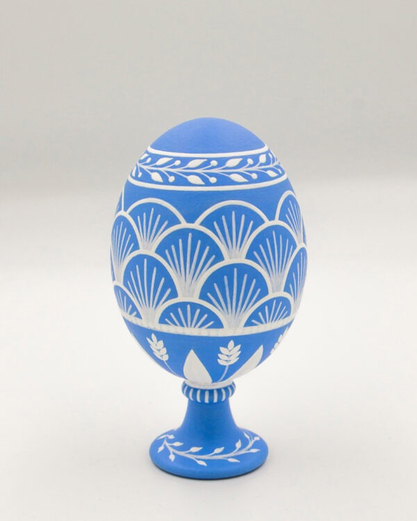 This is a white and blue hand-painted goose egg. A collection of hand-painted eggshells.