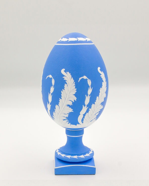 This is a white and blue hand-painted goose egg, depicting a tree
