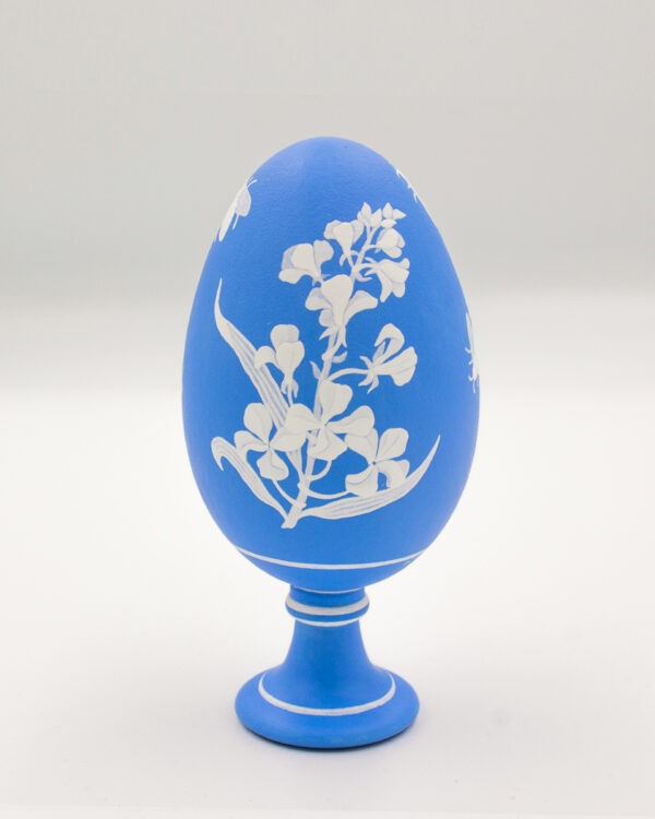 This is a white and blue miniature painted eggshells goose eggshell